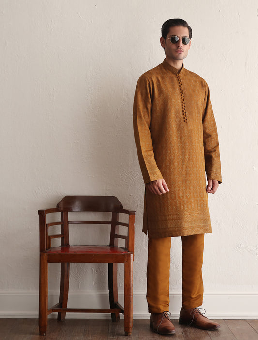 Mustard embroidered kurta with border on sleeves and daman