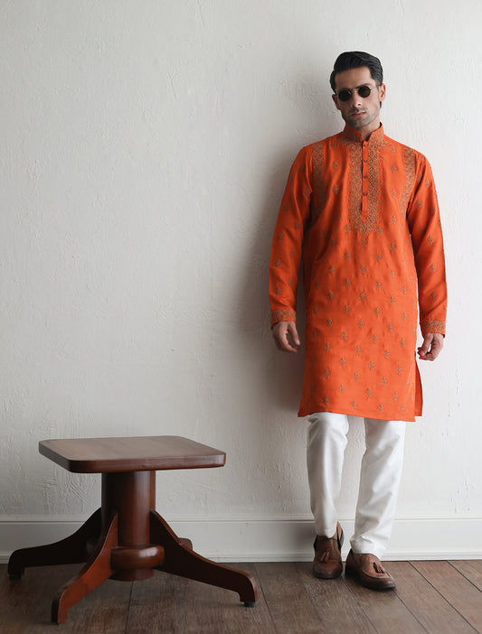 Orange embroidered kurta with heavy embellishment