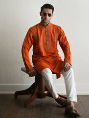 Orange embroidered kurta with heavy embellishment