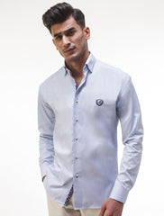 BLUE SHIRT FEATURING EMBROIDERED LOGO